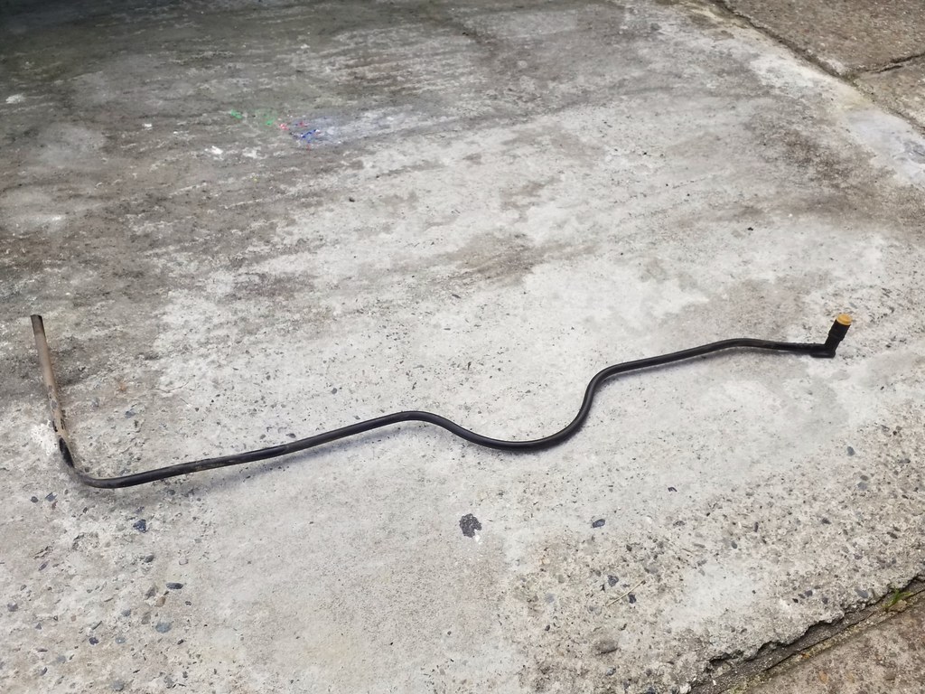 Salvaged piece of black Betty's fuel return line to use for repairs to 1988 saab 9000
