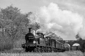 SE&CR Wainwright locomotives H Class 0-4-4T no.263 and C Class 0-6-0 no.592 head north from Three Arch Bridge with a passenger train on 1st May 1994