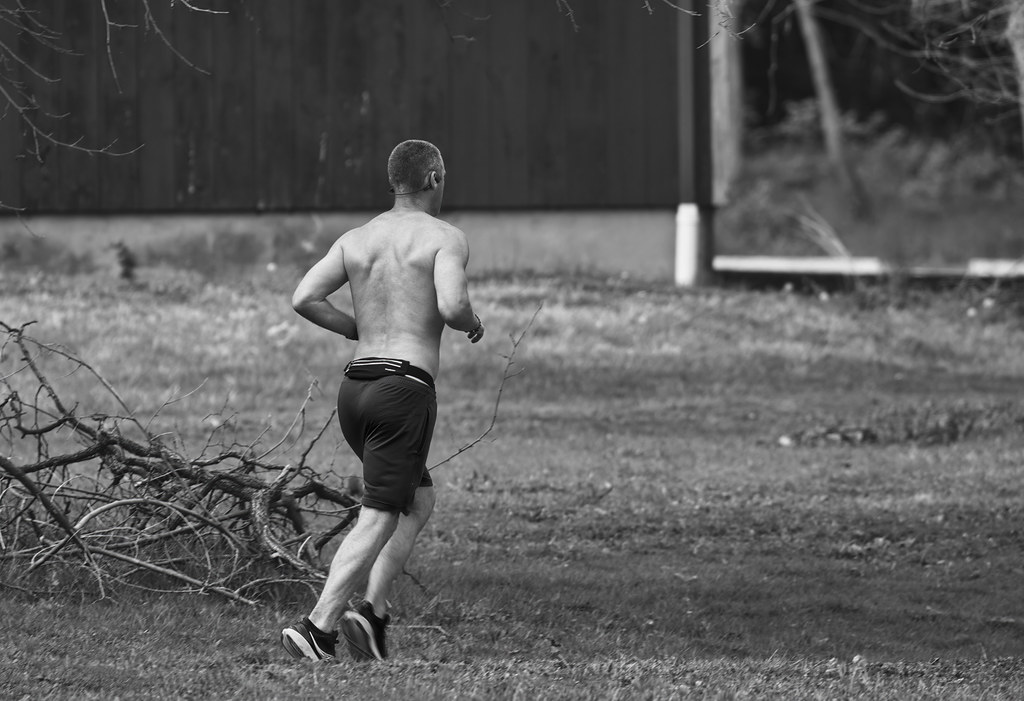 The running man | A man runs with headphones on, enjoying th…