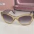Miu Miu SMU 11P TIM 4W1 Sunglasses Transparent Yellow Frame Dark Violet lenses