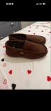 These are mens indoor slippers with a moccasin,style, closed-toe slip-on design.